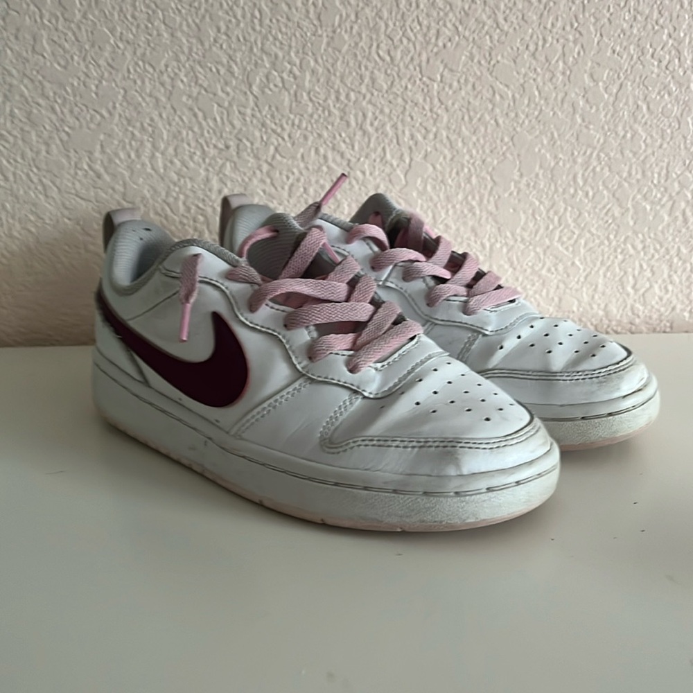 Pink and white court side Nikes